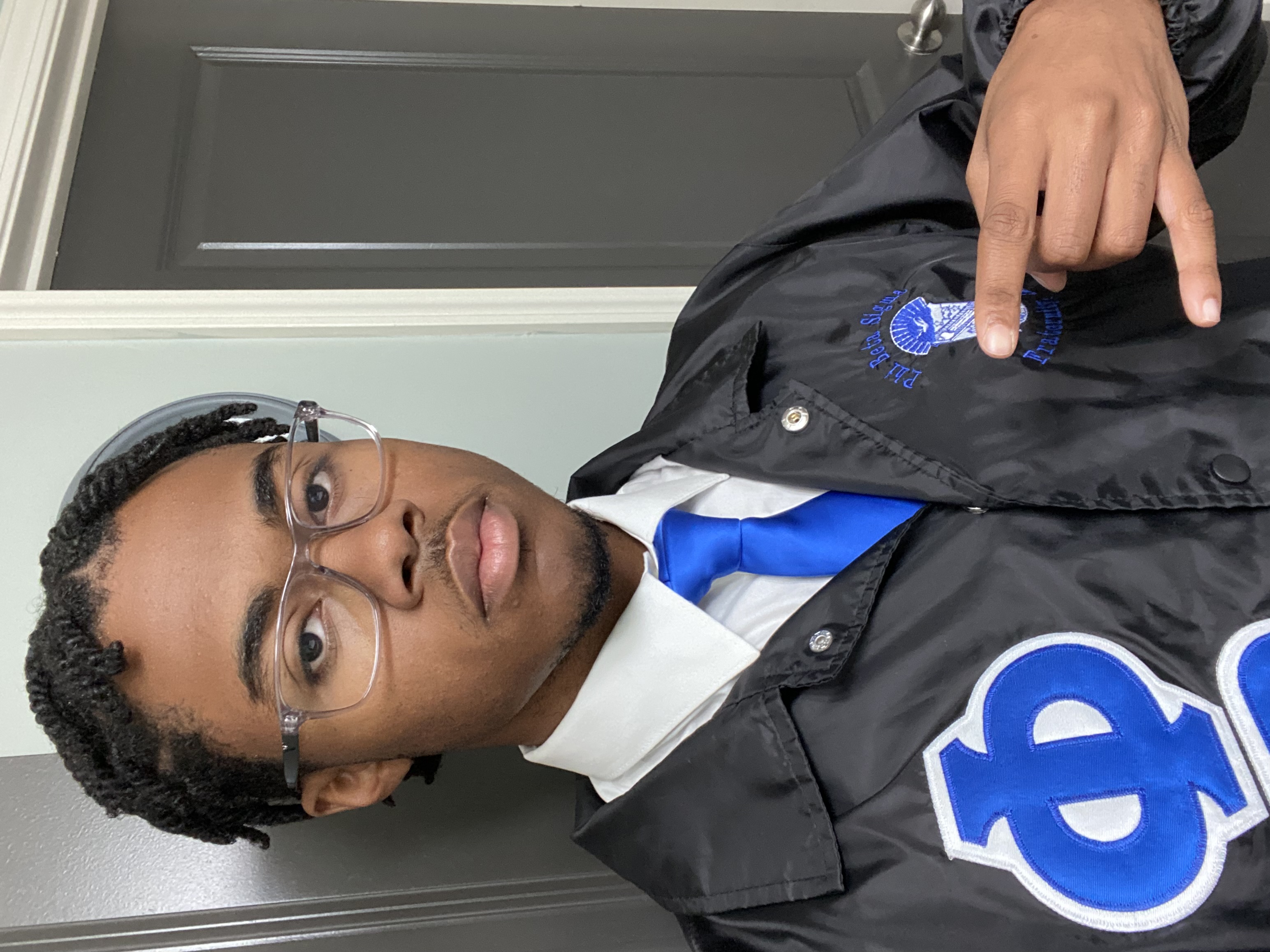 Marcus in his Phi Beta Sigma Fratnerity jacket